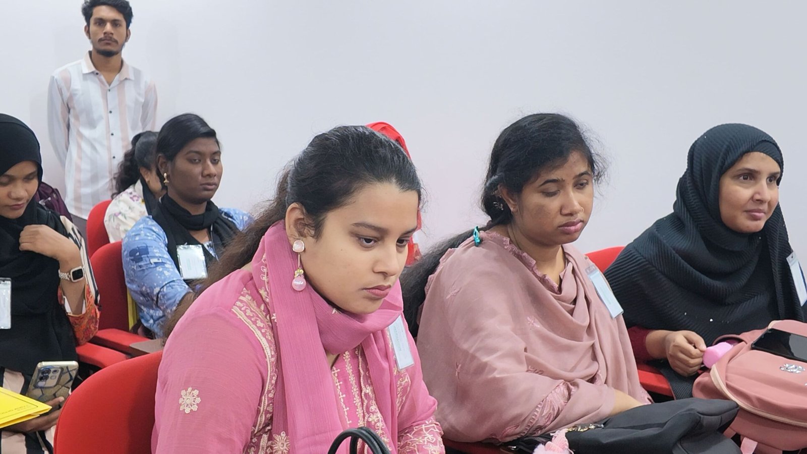 Young women with disabilities participating attentively in the Digital Rights & Resilience Bootcamp training room